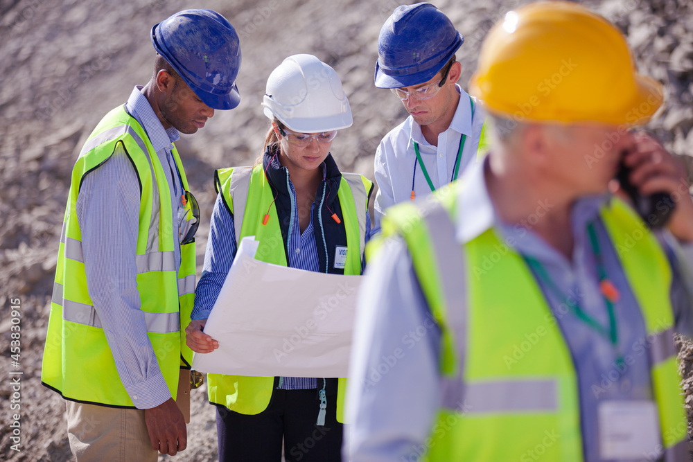 Worker holding clipboard on site Worker holding clipboard on site