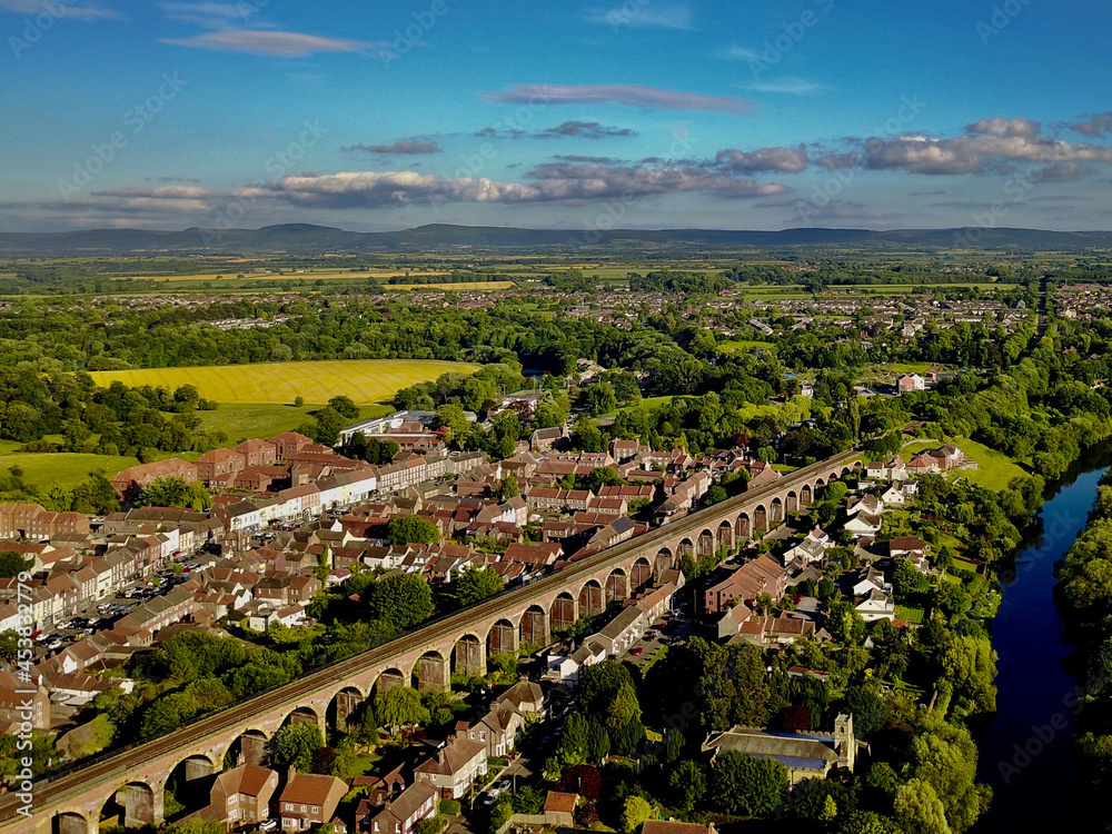 The skyline of historic market town of Yarm in North Yorkshire showing the railway viaduct