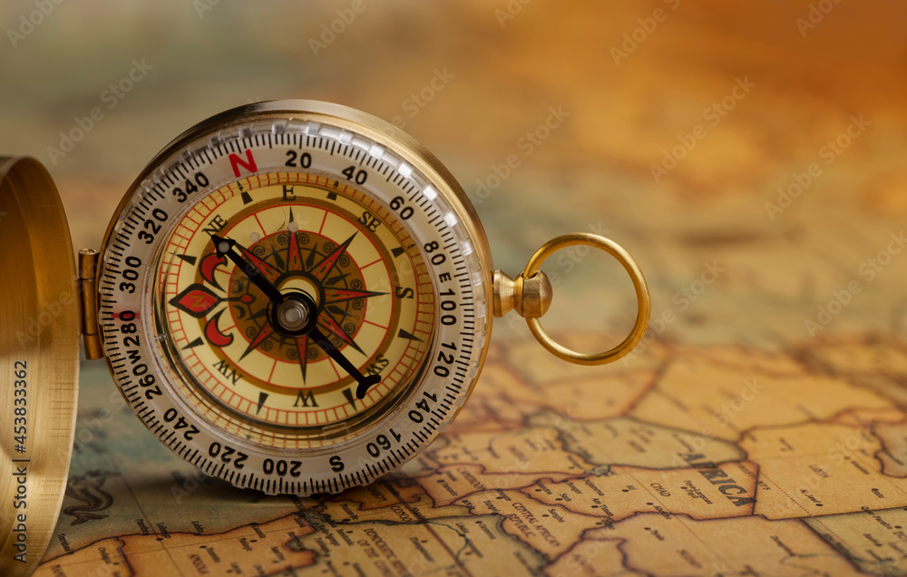 Classic compass on vintage map , Can be used as a background