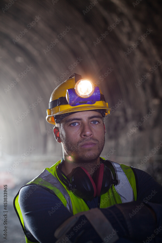 Fototapeta premium Worker using walkie-talkie in tunnel