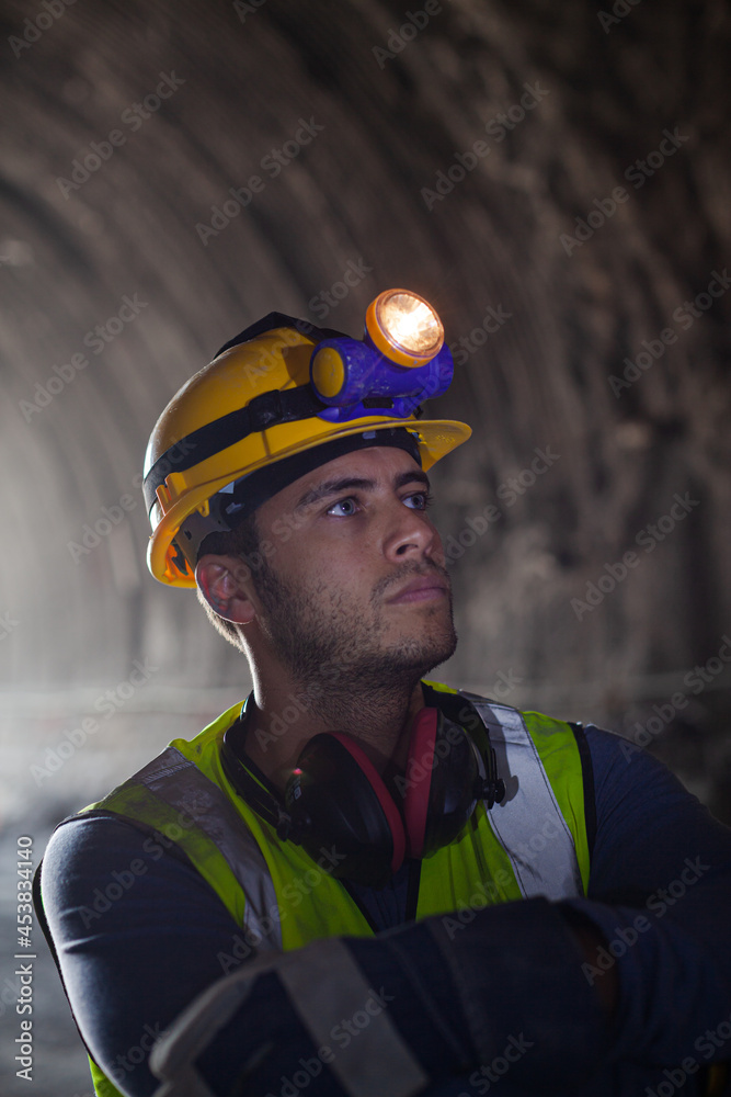 Businessman and worker standing in tunnel Businessman and worker standing in tunnel