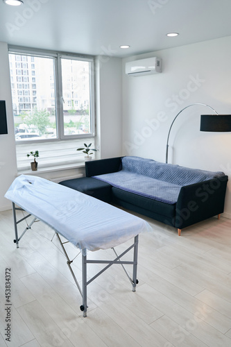 Image of medical rehabilitation office with massage table