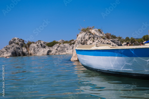 wooden boat on the water's edge © sinan
