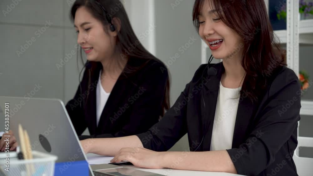 Call center or telemarketing taking notes and answering customer questions. Call center or telemarketing taking notes and answering customer questions.