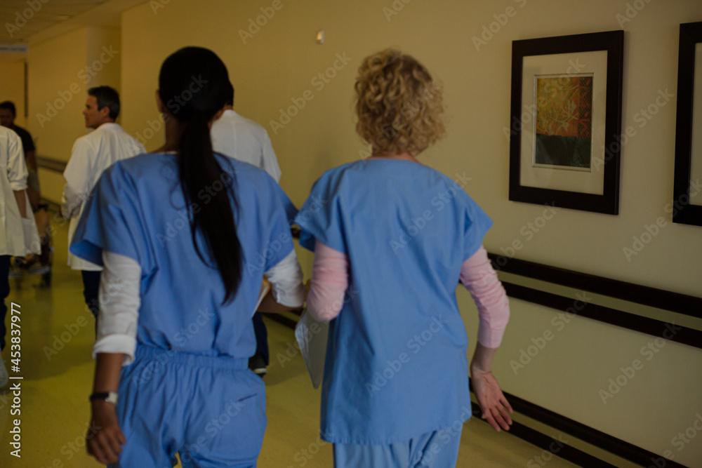 Doctors and nurses walking down hospital corridor Stock Photo Adobe Stock