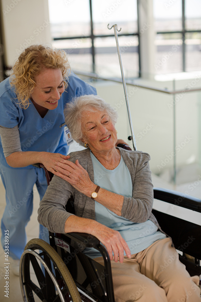 Portrait of smiling nurse and elderly patient in wheelchair Portrait of smiling nurse and elderly patient in wheelchair