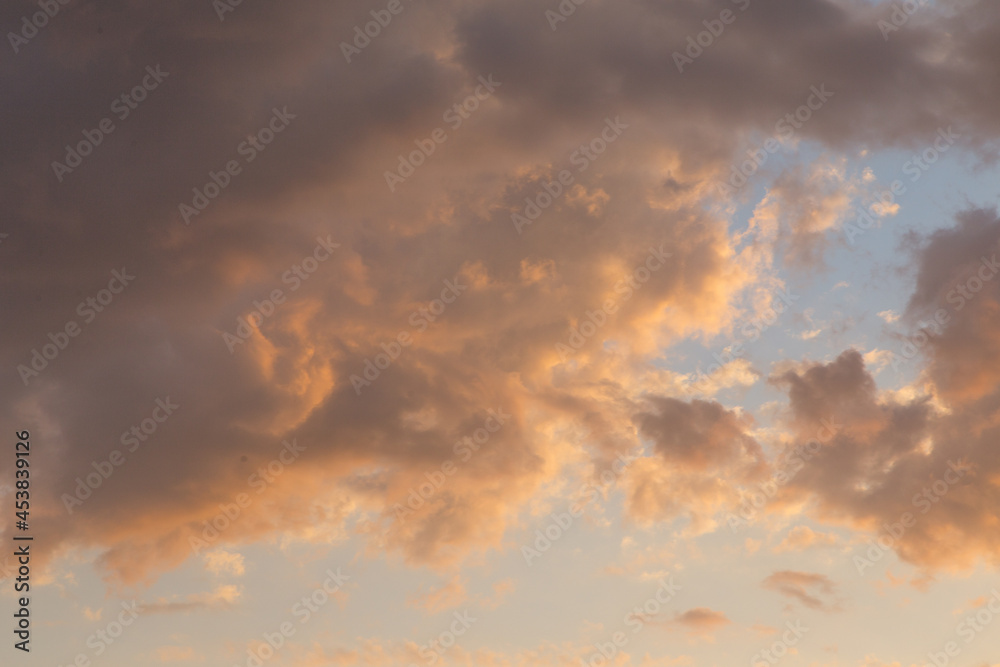 Golden sunset, clouds in the sky