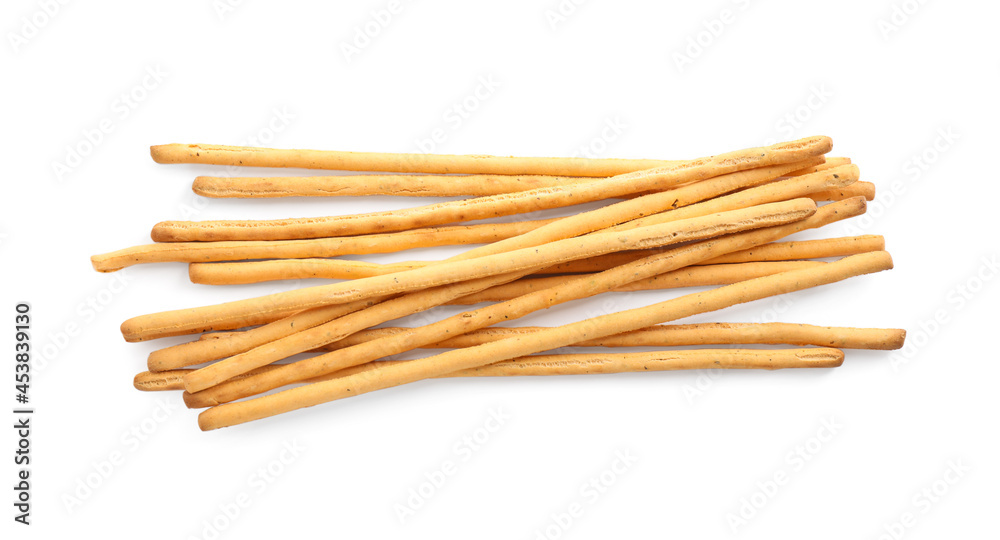 Delicious grissini sticks on white background, top view