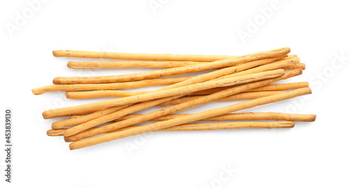 Delicious grissini sticks on white background, top view