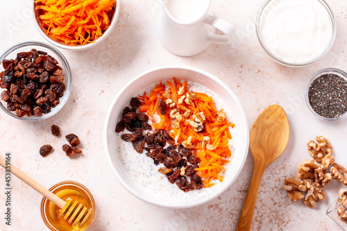 Bild auf Leinwand Carrot and raisins overnight oats with walnuts, high protein healthy breakfast
