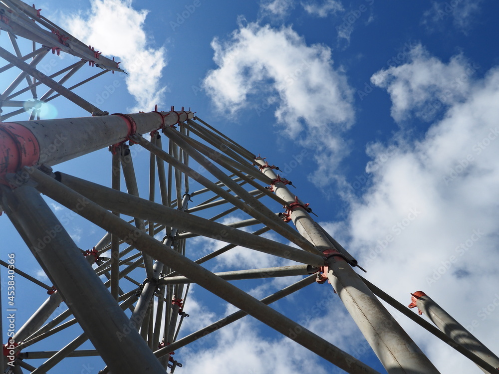 view of the structure from below, looking from above, sky with nice clouds, clear sky, and sun rays interesting angle, construction industry, iron concrete