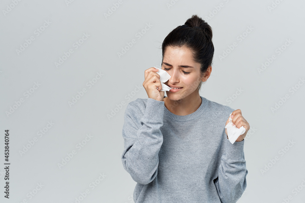 woman wipes her face with a handkerchief allergy infection health problems woman wipes her face with a handkerchief allergy infection health problems
