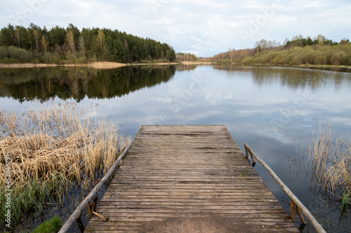 Rural landscape with an empty wooden pier