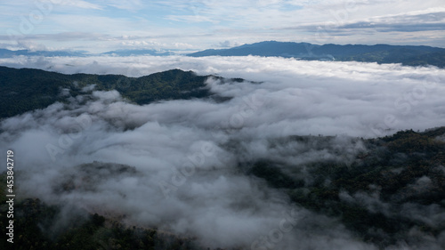aerial view of clouds on beautiful mountains beautiful nature that covers the fertile tropical forests of Nan Province Northern Thailand  Ya Luang Suan