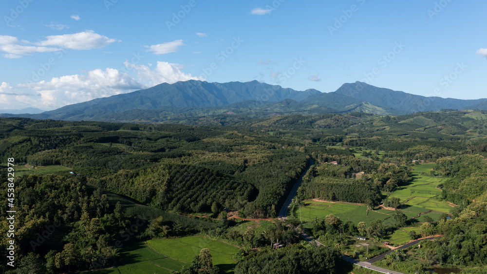 Fototapeta premium An aerial view of beautiful forest and mountain views. on a clear day Famous mountains of Nan Province, Northern Thailand, Doi Phu Kha