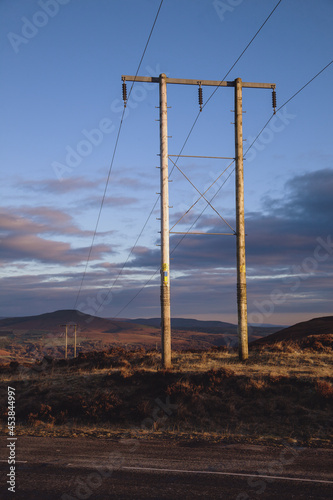 Sunrise Welsh landscape with telegraph pole