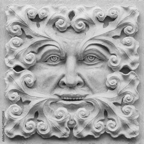 A stone carving of a Green Man. Decorative architectural ornament.