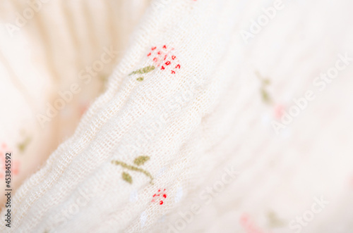 Beige cream with flower pattern material fabric fasion blur background