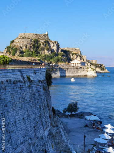 corflu island castle, liight and church of st george by the sea , greece photo