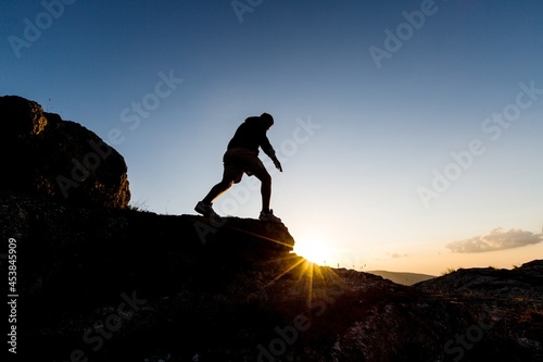 Man Walking on Rocks