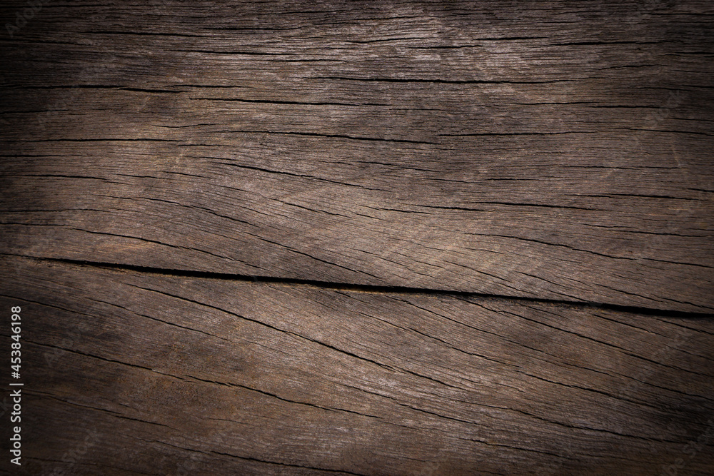 Naklejka premium Old wood texture background with natural cracks. Dark brown wood plank is used for background. 