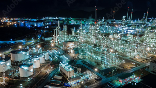 Aerial view Oil refinery. Industrial view at oil refinery plant form industry zone with sunrise and cloudy sky.