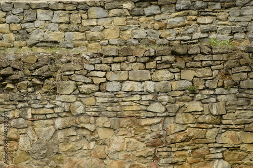 Old stone wall background, old castle wall, stone texture.