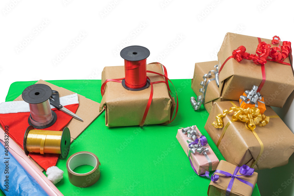 Obraz premium Сlose-up view of gifts packed in holiday boxes lying on the desktop. Christmas holiday concept. Postcard. Sweden. 