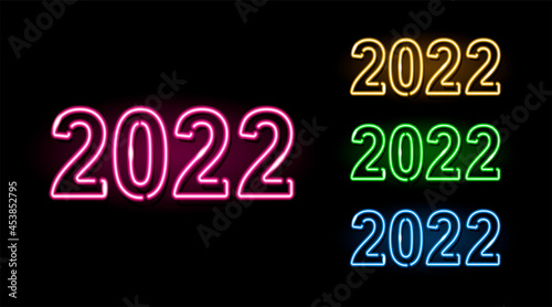 Set of neon 2022 banner in four different colors isolated on black background. Winter holidays, New Year concept. Night glowing neon signboard style. Vector 10 EPS illustration.