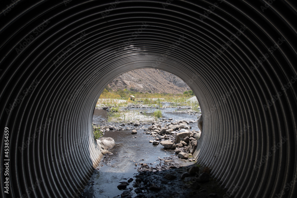 A Highway Culvert Bypass for a River under a Road - obrazy, fototapety, plakaty 