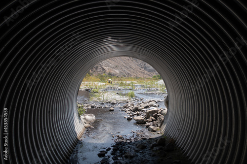 A Highway Culvert Bypass for a River under a Road photo