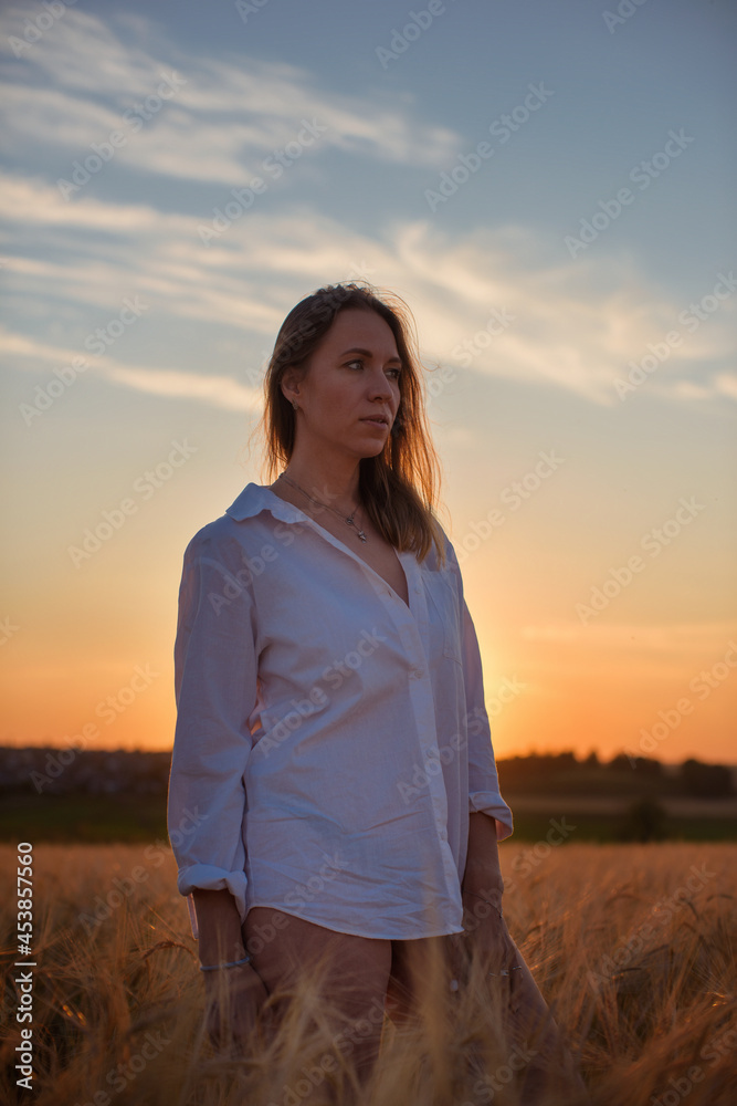 Aerial view of woman lying in the yellow field of wheat Aerial view of woman lying in the yellow field of wheat