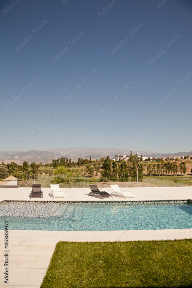 Swimming pool overlooking tree and mountains