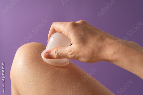 Self anti-cellulite massage with a silicone jar. Massage vacuum cups. Silicone jars for vacuum therapy.