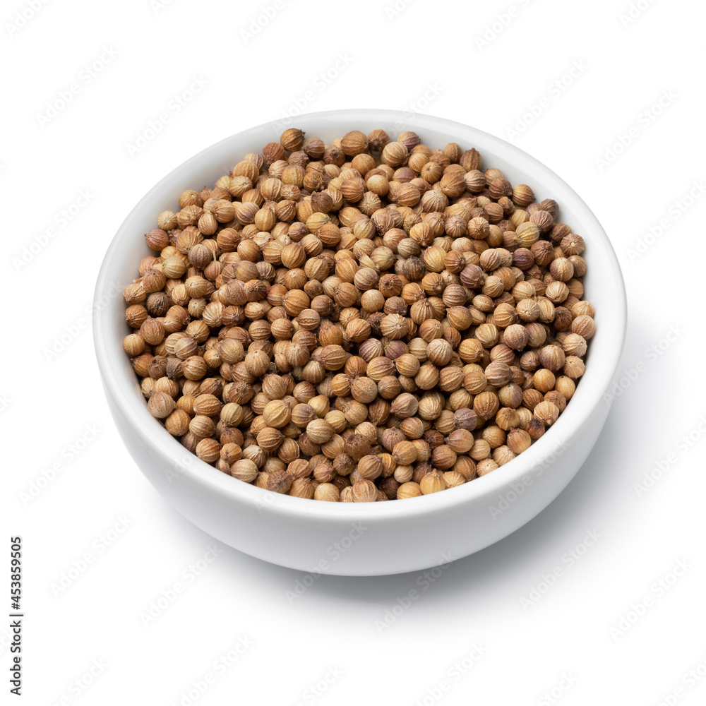 Bowl with dried coriander seed isolated on white background Bowl with dried coriander seed isolated on white background