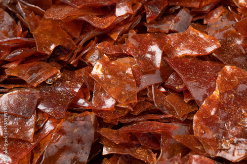 Brown Shellac dry flakes close up full frame as background  photo