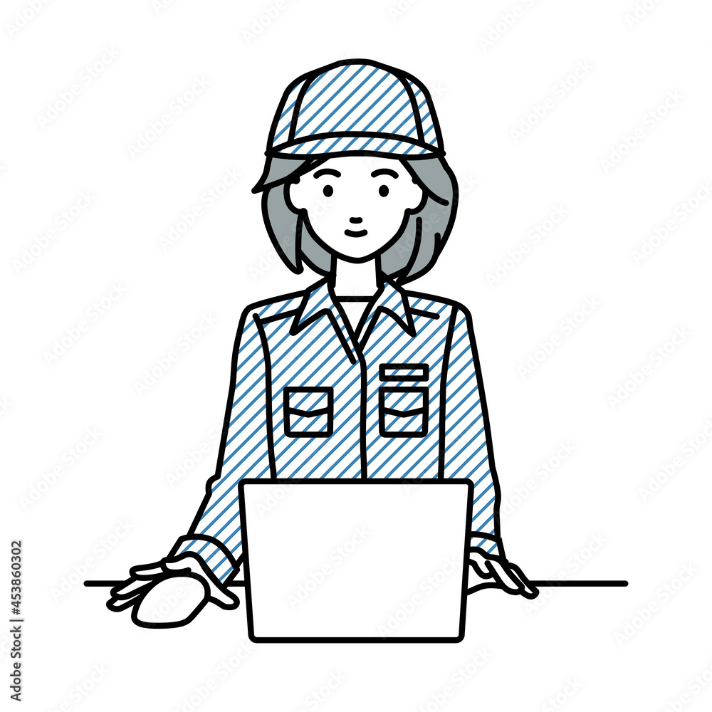 デスクで座ってPCを使っている作業員の女性 デスクで座ってPCを使っている作業員の女性