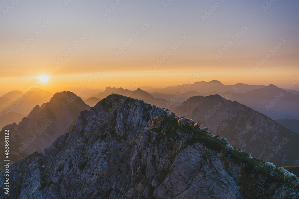 Sunrise in the mountains. View of the sunrise from the Stol,  Karawanken, Slovenia, Europe. Landscape of Karawanken mountain. Traveling concept.  - obrazy, fototapety, plakaty 