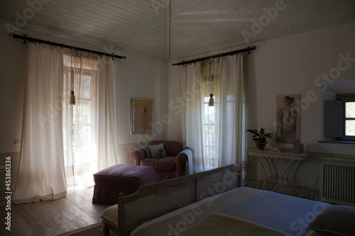 Sun shining through window into luxury bedroom