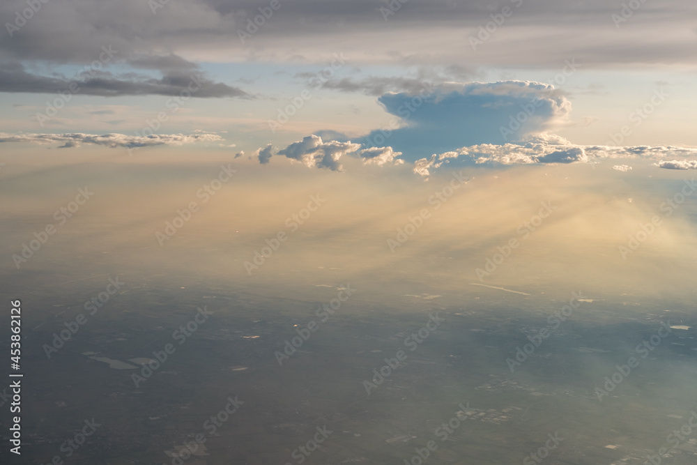 Colorful sky and cloud seen from window of airplane Colorful sky and cloud seen from window of airplane
