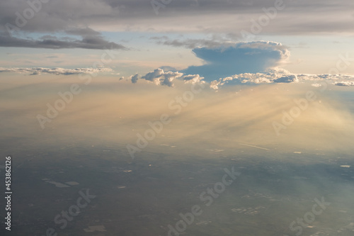 Colorful sky and cloud seen from window of airplane