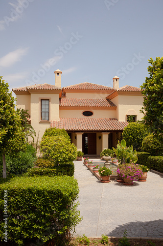 Potted plants in formal garden outside villa