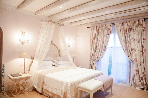 Bed with canopy in luxury bedroom © KOTO