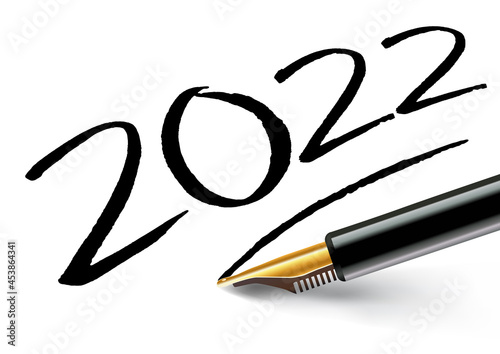 Vœux 2022 inscrit sur un papier blanc à l’encre noir avec un stylo plume et souligné comme une signature.