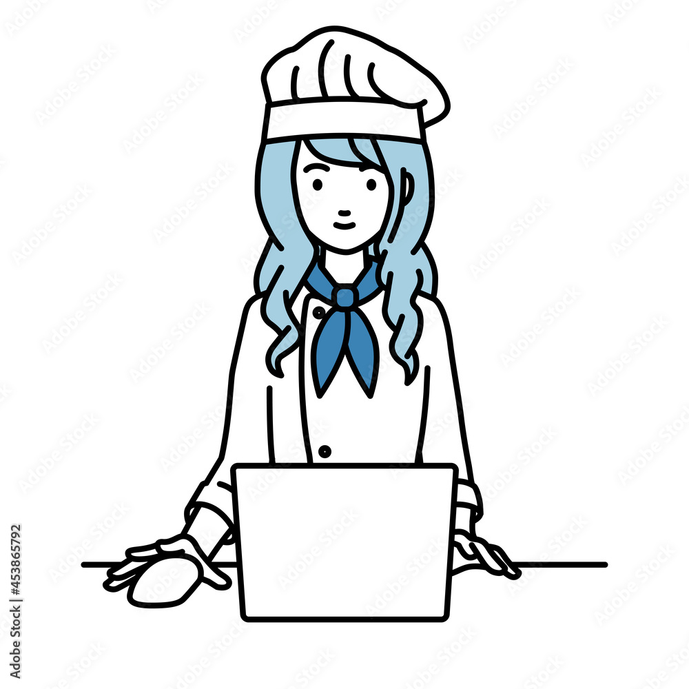デスクで座ってPCを使っている調理師の女性