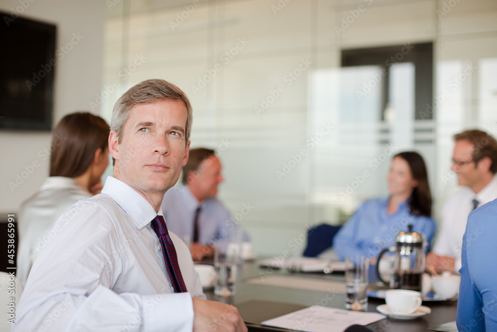 Business people sitting in meeting Business people sitting in meeting