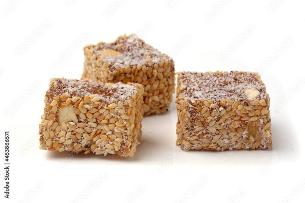 Traditional oriental sweets - Turkish Turkish delight on a white background. Traditional oriental sweets - Turkish Turkish delight on a white background.