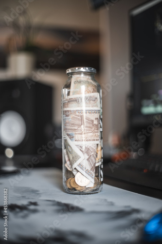 a bottle filled with money