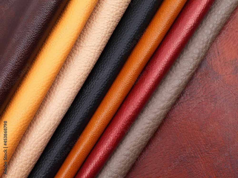 Natural leather textures samples on brown leather background Natural leather textures samples on brown leather background