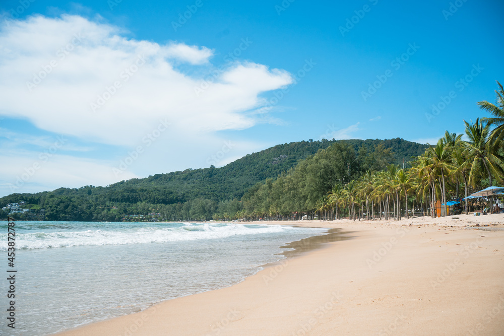 waves nature splashes sand beach on sunlight.blue sea and sky famous beach. waves nature splashes sand beach on sunlight.blue sea and sky famous beach.